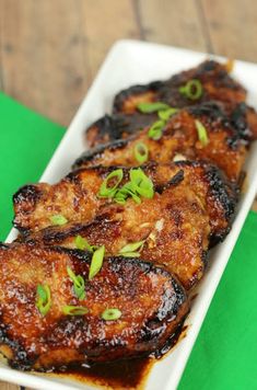 korean pork chops on a white plate with green napkin