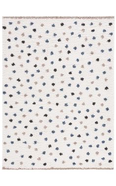 a white rug with small blue and black stars on the bottom, in front of a white background