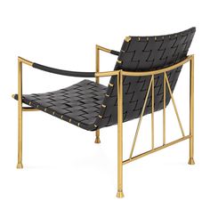 a black leather chair with gold metal frame