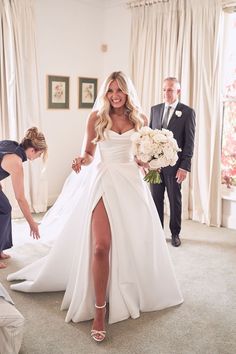 the bride is getting ready to walk down the aisle in her wedding dress and heels