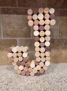 the letter j made out of wine corks