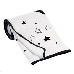 a white and black blanket with stars on it