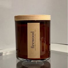 a candle with a label on it sitting on a table