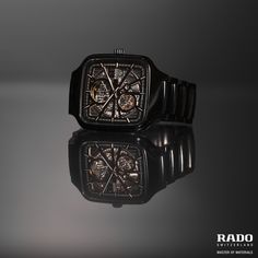 The shimmering black high-tech ceramic perfectly harmonises with the intricate pattern of windows in the dial so that you can stay in the moment forever. Luxury Gift Watch With Metal Dial, Rado Captain Cook, Rado Golden Horse, Rado True Square Open Heart, Black Metal Automatic Watches, Ceramic Watch, Automatic Watch