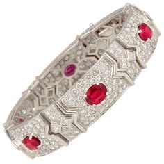 The ruby and diamond cuff bracelet features 6 oval cut rubies of pigeon blood color and crystalline texture for a total of 11.54 carats. The design is set with 11.25 carats of round diamonds en pavé, and 2.75 carats of princess cut diamonds decorating the bridges between the sections. All our diamonds are of top quality (F/G-VVS, color, clarity, and cut). Please note the extraordinary workmanship manifested in the ideal level of articulation. The bracelet is one-of-a-kind. It was entirely handma Ruby Diamond Bracelet, Blood Ruby, Diamond Cuff Bracelet, Tiaras Jewellery, Ruby Bracelet, Diamond Tiara, Antique Bracelets, Gold Bracelet Cuff, Bracelet Design