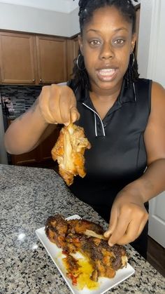 a woman is eating some food on a plate