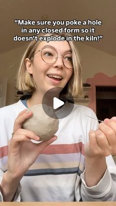 a woman is holding a rock in one hand and an object in the other with a caption that reads, make sure you poke a hole in any closed form so it doesn't explode