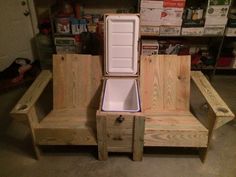 a wooden bench with an ice chest on it