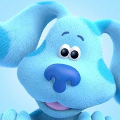 the blue dog is smiling and looking at something with his eyes wide open on a blue background