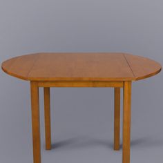 a small wooden table with two leaves on the top