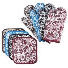 three oven mitts with different designs on them