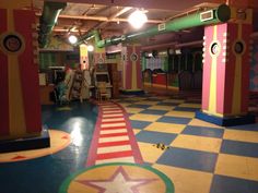 an indoor play area with colorful walls and flooring