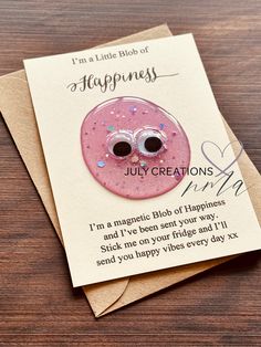 a card with a pink donut on it