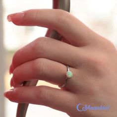 This delicate Sterling Silver Opal Promise Ring features a 6 mm cabochon that has been carefully set in a highly polished fine silver bezel. The band is made of a sturdy round Sterling Silver wire that has been given a hammer texture, then carefully polished for a bright finish. Our setting process involves carefully tightening the fine silver bezel down around the stone, then beveling at the edge of the bezel to further compress the silver, creating a water-tight seal with no stone movement. Th Simple Opal Ring, Opal Ring Simple, Opal Birthstone Ring, Dainty Opal Ring, Opal Promise Ring, Rings Pandora, Promise Rings Simple, Opal Stacking Ring, Sterling Silver Opal Ring