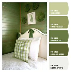 a bedroom with green walls and white bedding in the color scheme, which is well suited