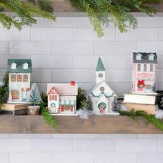 a shelf with christmas decorations and books on it