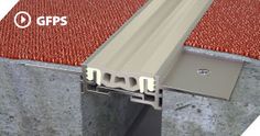 an image of a metal gutter that is attached to the ground with red carpet