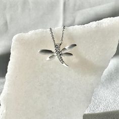 A timeless and classic design, symbolizing strength and everlasting love. Perfect for everyday wear or dressed up for special occasions. Add a pop of color with our Genuine Diamond Dragonfly Pendant, available in 18k solid white gold and 18k solid rose gold. 14k solid yellow gold and 14k solid white gold chain available for purchase upon request. Please feel free to message us and we'll open up the chain options.  Item Specifications: Materials: 18k Solid Gold  Gemstone: Natural Diamonds  Pendan Diamond Jewelry With Timeless Design For Gift, Timeless Sterling Silver Jewelry In Silver, Silver Jewelry With Timeless Design For Gift, Timeless Diamond White Jewelry As A Gift, Diamond White Jewelry With Timeless Design As Gift, Diamond White Jewelry With Timeless Design For Gift, Timeless Design White Gold Jewelry Gift, White Gold Chain, Dragonfly Pendant