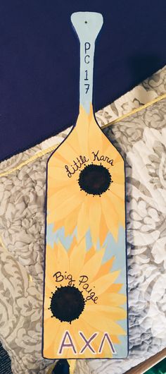 a bottle shaped like a sunflower with the name ava on it's side