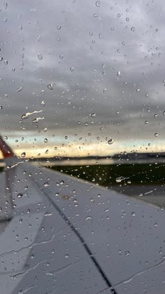 rain drops on the window of an airplane