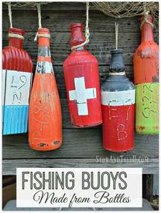 red, white and blue buoys are hung on a wooden fence with the words fishing boys made from bottles