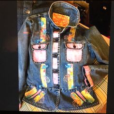 an old jean jacket with patches on it