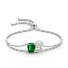 Shimmering with your affection, this bracelet shoots straight to her heart. Crafted in sterling silver, it features a glittering emerald cut stone to bring out it's beauty and sparkle. Additional stones form leaf-shaped design to add more elegance to this bracelet. She'll admire the nature-inspired details of this lovely leaf bracelet.Carat Weight: 2.76 ctStone Size: 8*10 mmNumber of Stones: 1 Stone Shape: RadiantStone Color: Emerald GreenCarat Weight: 0.65 ctStone Size: 1.2,1.1,1,0.8,1.8,1.7,1. Emerald Green Stone, Jewelry Rendering, Silver Jewelry Set, Leaf Bracelet, Silver Jewellery Sets, Leaf Jewelry, Bracelet Online, Wedding Jewelry Sets, Sterling Silver Bracelet