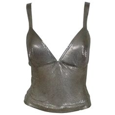 Paco Rabanne Silver Metal Mesh Tank Top For Sale at 1stDibs | silver tank top, metal mesh top, silver mesh top Metallic Fitted Tank Top, Party Vest Crop Top With Tank Straps, Silver Sleeveless Tank Top For Club, Party Crop Top With Tank Straps And Vest Detail, Fitted Silver Tops For The Club, Silver Tank Top For Club, Metallic Tank Top For Night Out, Glamorous Silver Party Tank Top, Glamorous Fitted Metallic Tank Top