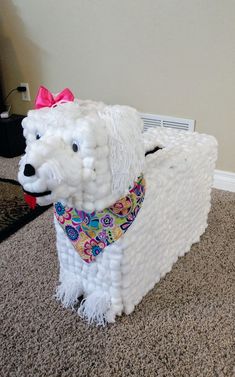 a dog made out of toilet paper on the floor