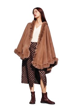 Add a toasty yet glam finish to your elegant ensemble with this draped cape that is trimmed with faux fur. Open front Short sleeves Shell/faux fur: 100% polyester
 Hand wash, line dry Imported Elegant Cape Fur Coat With Faux Fur Trim, Elegant Fur Cape Coat With Faux Fur Trim, Winter Cape-shaped Faux Fur Coat, Elegant Faux Fur Cape With Lining, Elegant Cape-style Fur Coat With Faux Fur Lining, Faux Fur Winter Cape Coat, Elegant Cape With Faux Fur Lining, Elegant Fur Coat With Faux Fur Trim Cape, Elegant Fur Cape Coat For Fall