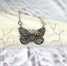 ✨️FREE SHIPPING (USPS First-Class Mail ONLY) and will ship out in ONE BUSINESS Day ✨️ Elevate Your Style with a Touch of Vintage Elegance Unveiling our mesmerizing Steampunk Butterfly Necklace, a masterpiece that transports you to an era of whimsical charm and mechanical marvels. Crafted with meticulous attention to detail, this one-of-a-kind necklace captures the essence of steampunk with its intricate gears, antique finishes, and dazzling crystal accents. At the heart of this piece lies a grac Handmade Black Steampunk Necklace, Vintage Handmade Butterfly Necklace, Handmade Steampunk Jewelry For Festivals, Handmade Adjustable Steampunk Necklace, Adjustable Handmade Steampunk Necklaces, Dragonfly Jewelry Necklace, Steampunk Butterfly, Dragonfly Jewelry, Jewellery Unique