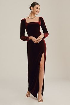 Crafted from luxe, stretch velvet, the Rachel Gown is as chic as she is modern. Its sleek square neckline and sophisticated long sleeves are perfectly balanced by a form-fitting pegged skirt that features a sultry side slit. | Rachel Square-Neck Long-Sleeve Side-Slit Stretch Velvet Gown by Jenny Yoo in Red, Women's, Size: 12, Polyester/Elastane at Anthropologie Pegged Skirt, Velvet Dress Long, Velvet Prom Dress, Long Sleeve Velvet Dress, The Rachel, Red Velvet Dress, Velvet Gown, Jenny Yoo, Square Neck Dress