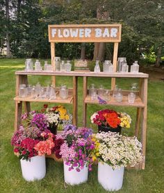 flower bar with flowers in buckets and jars