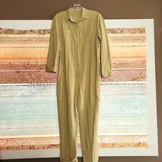 Button Up Style 100% Cotton Fabric 2 Chest Pockets, 2 Side Pockets, 2 Back Pockets Machine Wash Cold Measurements P-P 19.5" Waist 18" Hips 19" Length 53" *Color Is A Darker Green Than The Picture..* Green Button-up Jumpsuits And Rompers, Solid Button-up Jumpsuits And Rompers, Khaki Cotton Long Sleeve Jumpsuits And Rompers, Green Button-up Jumpsuit, Khaki Long Sleeve Jumpsuits And Rompers For Work, Fall Workwear Khaki Jumpsuits And Rompers, Fall Khaki Jumpsuits And Rompers For Work, Green Jumpsuits And Rompers For Work With Button Closure, Green Cotton Jumpsuits And Rompers For Work