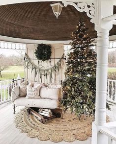 a living room with a christmas tree in the corner