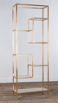 a gold shelving unit with four shelves