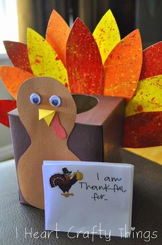 an image of a thanksgiving card holder made out of paper and cardboard with a turkey on it