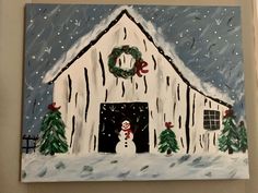 a painting of a barn with a snowman and wreath on the front door window