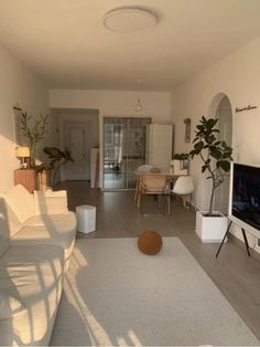 a living room filled with furniture and a flat screen tv