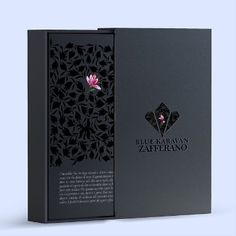 the packaging is designed to look like a book with a flower on it and black paper