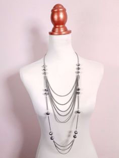 This vintage pre-loved Y2K necklace features a long multi-tiered design made up of stylish, interspersed faceted grey glass beads and draped multi-roped chains. Finished with an extender and lobster claw clasp. Era - Y2K early 2000s Materials - Silver coloured metal and glass beads 52cm to 55cm drop 12mm Bead width Excellent condition Early 2000s Necklaces, 2000s Necklace, Early 2000s Jewelry, 2000s Jewelry, 20s Style, Y2k Necklace, Tiered Necklace, 20s Fashion, Grey Glass