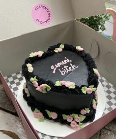 a heart shaped birthday cake in a box