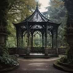 a gazebo in the middle of a park surrounded by trees