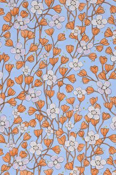 an orange and white flower pattern on a blue background