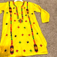 Pakistani Shalwar Qameez Fir Girls Never Worn. New With No Tag. Embroidered Sheesha And Hand Work. For Approx 10 To 11 Year Old Cotton Long Sleeve Dress With Mirror Work, Long Sleeve Cotton Dress With Mirror Work, Traditional Wear With Mirror Work And Shantoon Fabric, Traditional Shantoon Dress With Chikankari Embroidery, Traditional Yellow Dress With Dabka Detailing, Traditional Yellow Dress With Dabka, Multicolor Cotton Dress With Dabka, Traditional Summer Kurta For Ceremonies, Yellow Long Sleeve Kurta With Mirror Work