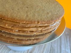 a stack of pancakes sitting on top of a metal plate