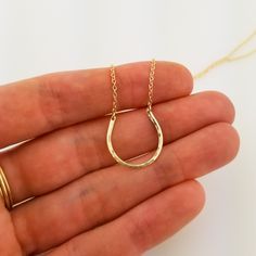 Add a little bit of luck to your day! Solid 14k yellow gold hammered horseshoe necklace on a dainty, but sturdy, 1.3 mm solid 14k gold oval cable chain featuring a lobster clasp. The light hammering effect adds an extra little sparkle to this special necklace. Perfect for everyday wear and as a layering necklace. Material: Solid 14K Yellow Gold Horseshoe Dimensions: Approximately 3/4 inch wide x 3/4 inch tall Necklace Length: 16 inches or 18 inches Custom Orders welcome in different sizes. The c 14k Yellow Gold Horseshoe Jewelry, 14-karat Yellow Gold Horseshoe Jewelry, Dainty Horseshoe Jewelry As A Gift, Dainty Horseshoe Jewelry For Gifts, Dainty Horseshoe-shaped Jewelry Gift, Everyday Gold Horseshoe Necklace, Horseshoe Shaped Yellow Gold Jewelry Gift, Horseshoe-shaped Yellow Gold Jewelry Gift, Dainty Hammered 14k Gold Necklace