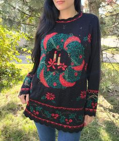 Fab 1980s/90s Christmas sweater! Model is a modern size small and this is fits like a small to medium depending upon how you like fit. Please see measurements below to ensure it'll fit you before purchasing.  This is in good condition with some pilling, please see pictures for details. Measurements, laid flat: (has a little bit of stretch in fabric) Length- 28.5" Pit to pit- 21.5" Waist- 21" Thanks for looking! 90s Christmas, Pullover Outfit, Holiday Christmas, Poinsettia, Christmas Wreath, Christmas Sweater, Pullover Sweater, Vintage Black, Pullover Sweaters