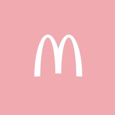 a white mcdonald's logo on a pink background with the letter m above it