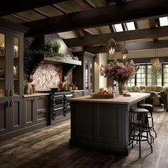 a large kitchen with an island in the middle and lots of counter space next to it